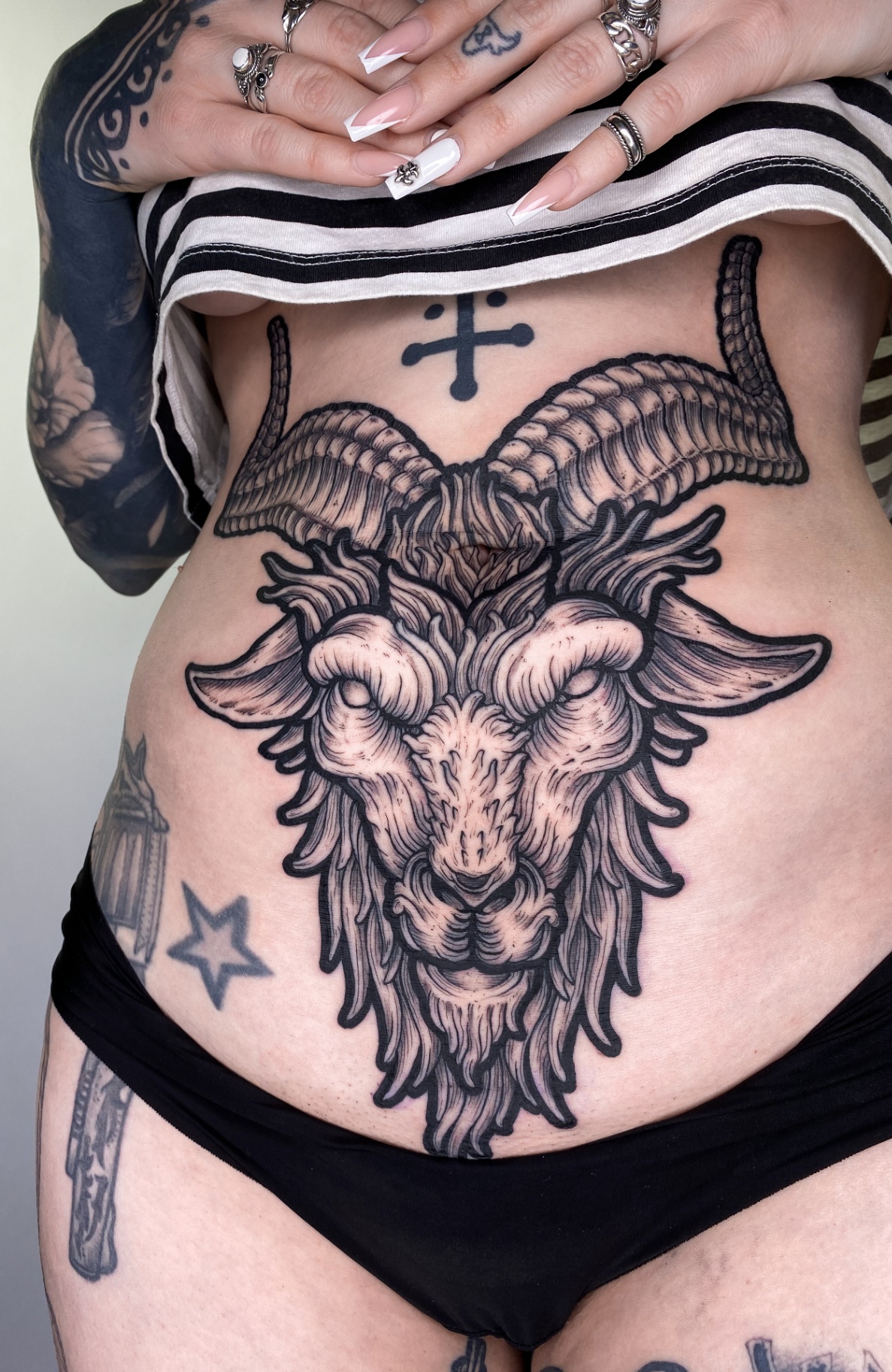 Engraving-style Baphomet stomach tattoo